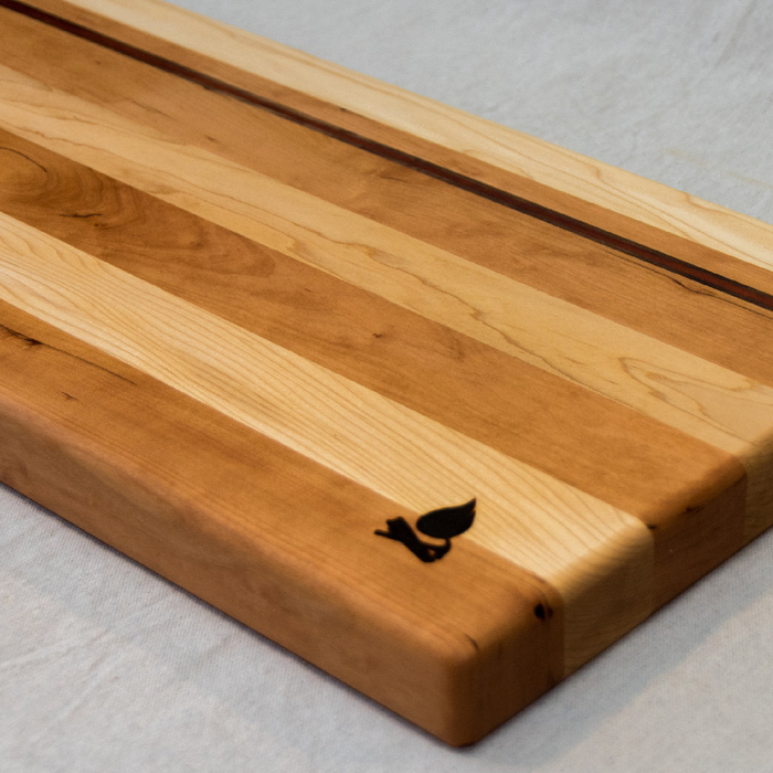 Maple with stripes of Walnut, Cherry, and Padauk Cutting Board