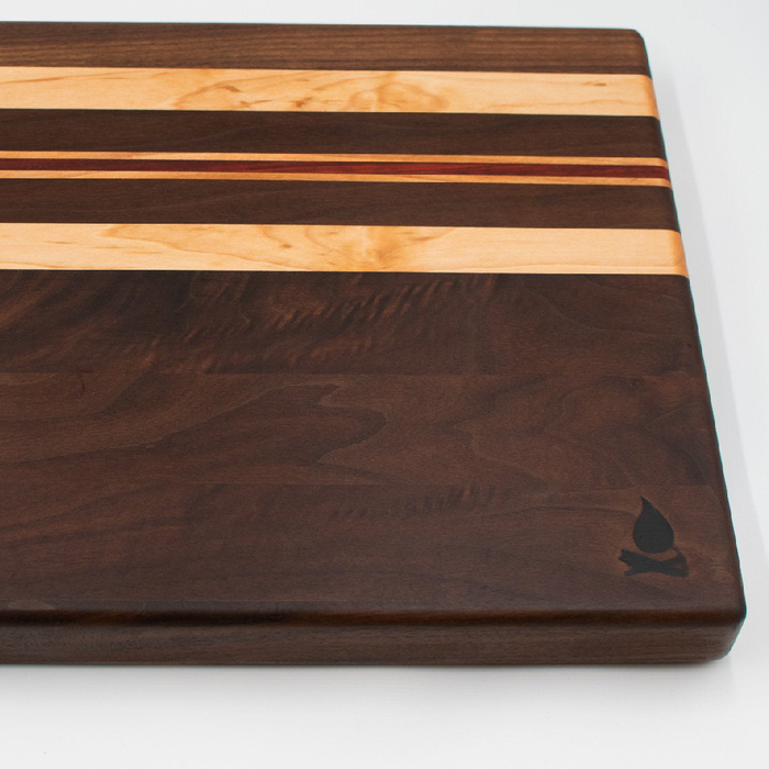 Walnut with stripes of Maple and Padauk Cutting Board