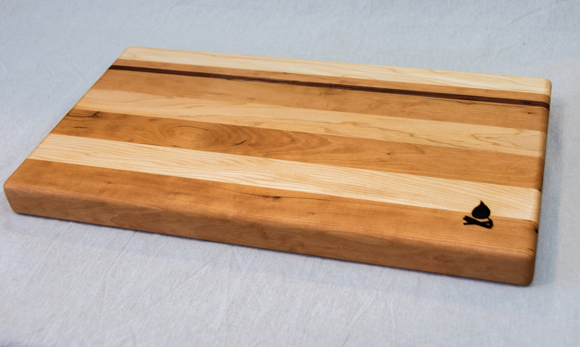 Maple with stripes of Walnut, Cherry, and Padauk Cutting Board