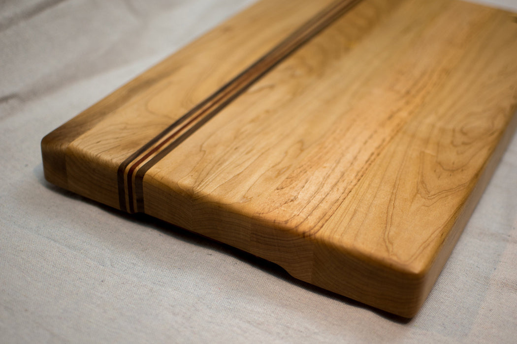 Maple with stripes of Walnut and Padauk Cutting Board or Butcher Block